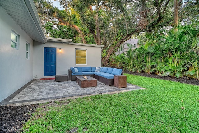 730 40th St, Sarasota, FL 34234 - view of green lawn with an outdoor living space with a fire pit and a patio area