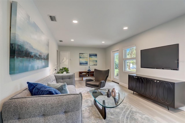 730 40th St, Sarasota, FL 34234 - living room featuring light wood-type flooring and recessed lighting