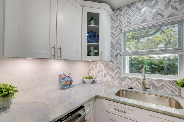 730 40th St, Sarasota, FL 34234 - kitchen featuring glass insert cabinets, white cabinets, and backsplash