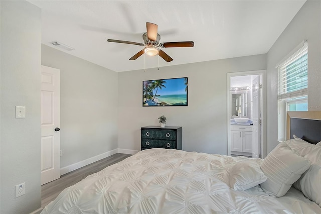 730 40th St, Sarasota, FL 34234 - bedroom featuring wood finished floors, ensuite bathroom, and ceiling fan