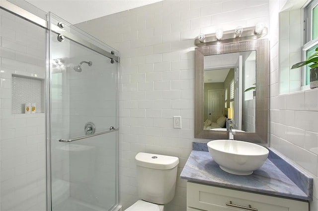 730 40th St, Sarasota, FL 34234 - full bathroom featuring tile walls, a stall shower, and vanity