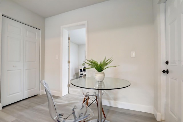 730 40th St, Sarasota, FL 34234 - dining room with baseboards and light wood-style flooring