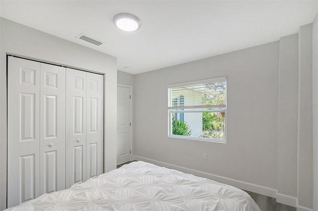 730 40th St, Sarasota, FL 34234 - bedroom featuring baseboards and a closet