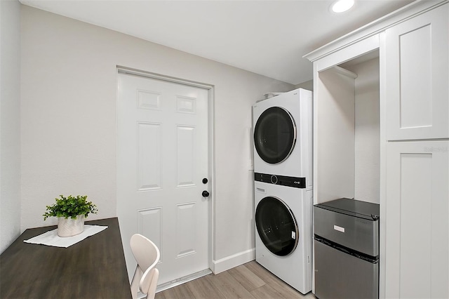 730 40th St, Sarasota, FL 34234 - laundry room with stacked washer / drying machine, light wood finished floors, and recessed lighting