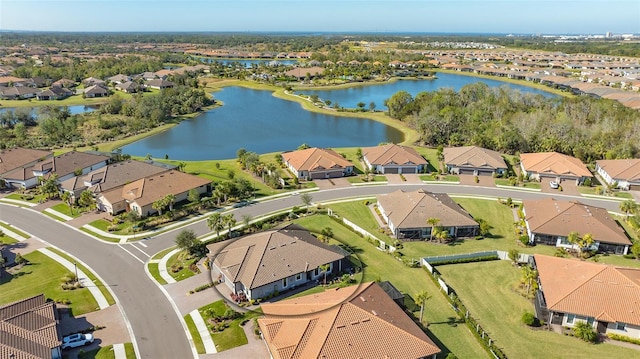 aerial view with a water view and a residential view