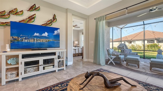 living room featuring ceiling fan and light tile patterned flooring