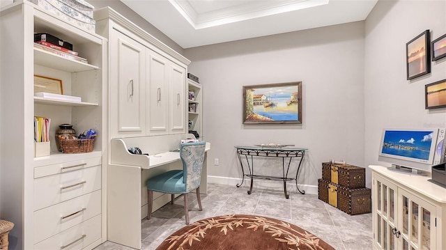 office area with built in shelves, light tile patterned floors, a raised ceiling, and ornamental molding