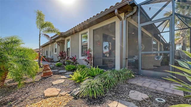 view of home's exterior with a lanai