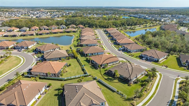 drone / aerial view with a water view