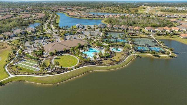 birds eye view of property with a water view