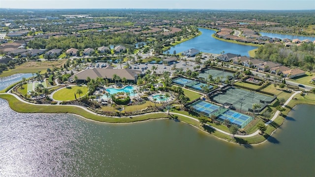 birds eye view of property with a water view