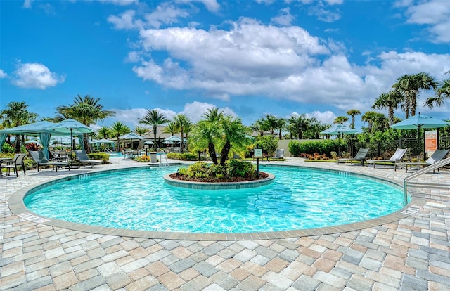 view of pool featuring a gazebo and a patio area