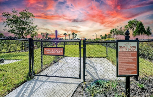 gate at dusk with a lawn