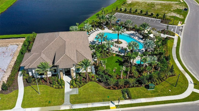 birds eye view of property with a water view