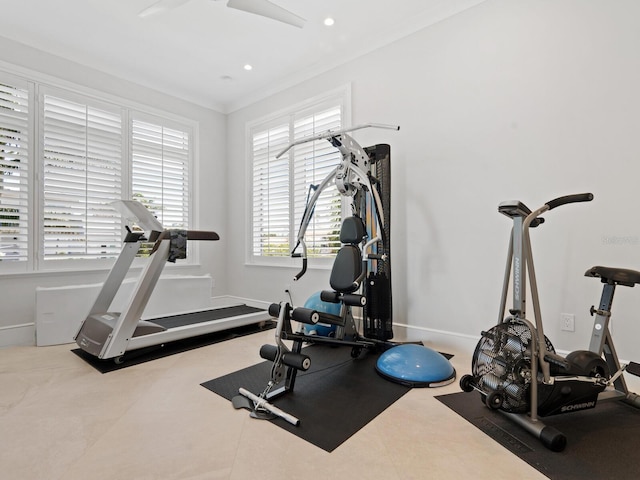 exercise room featuring ornamental molding