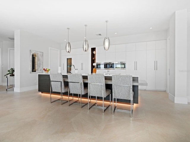 tiled dining room with sink