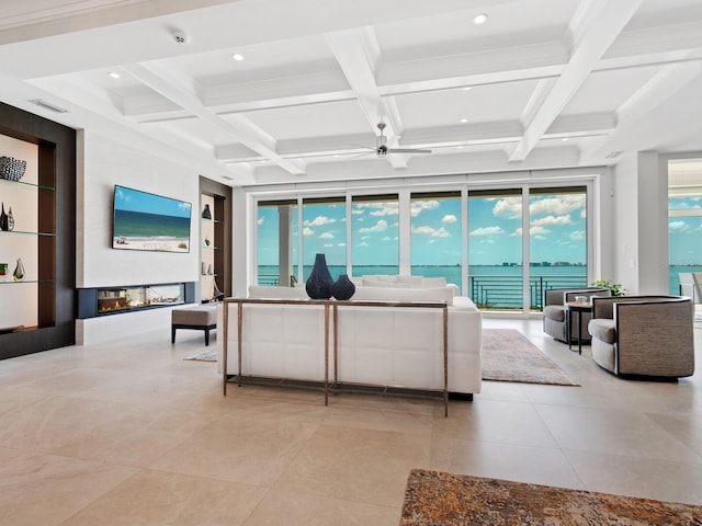 living room featuring built in shelves, ceiling fan, beamed ceiling, and coffered ceiling