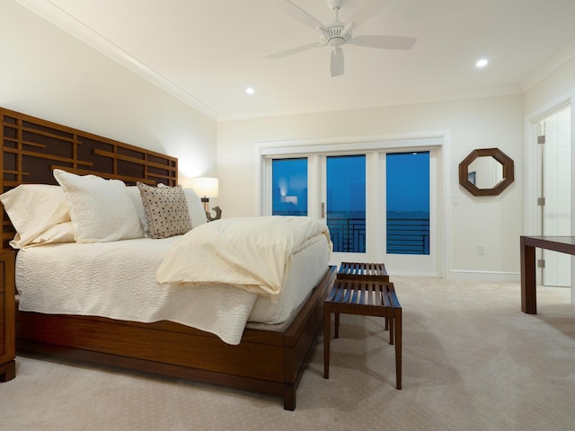 carpeted bedroom with ceiling fan and ornamental molding