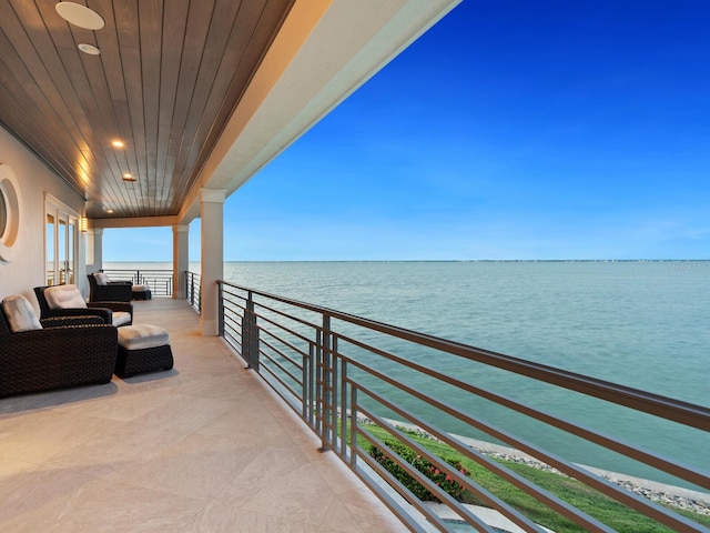 balcony featuring a water view