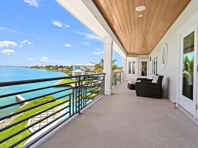 balcony featuring a water view