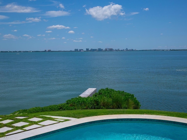 view of pool with a water view