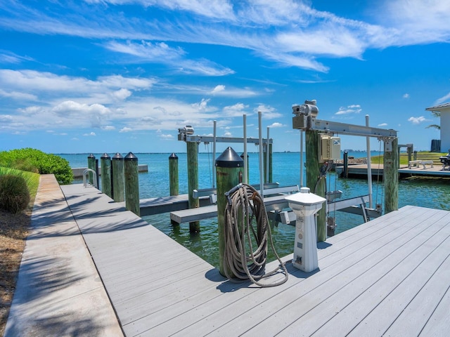 dock area with a water view