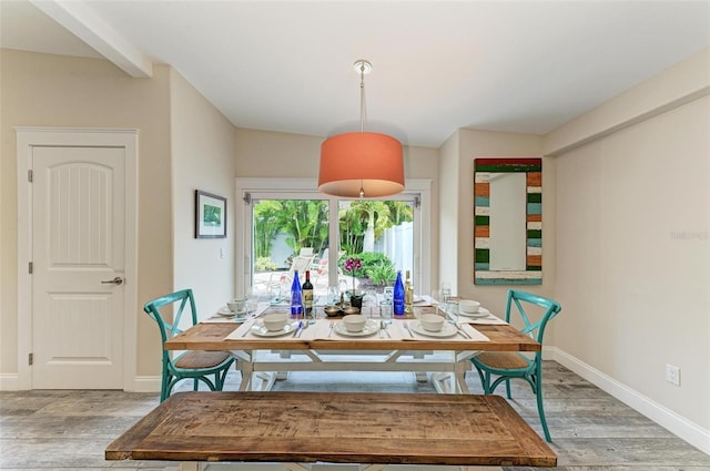 dining space with light hardwood / wood-style flooring