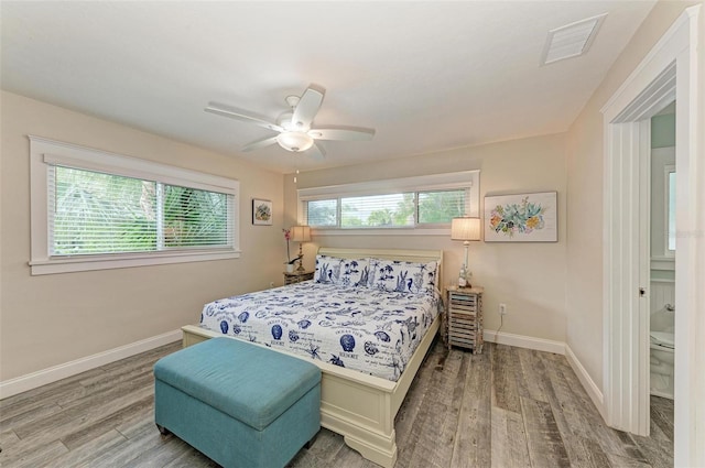 bedroom with ceiling fan and wood-type flooring