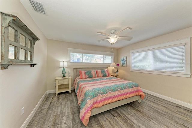 bedroom featuring hardwood / wood-style floors and ceiling fan