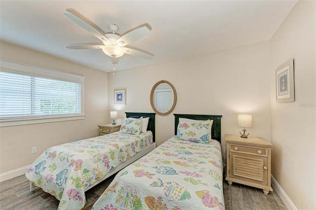 bedroom with ceiling fan and hardwood / wood-style flooring