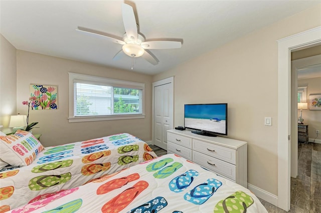 bedroom featuring ceiling fan and a closet