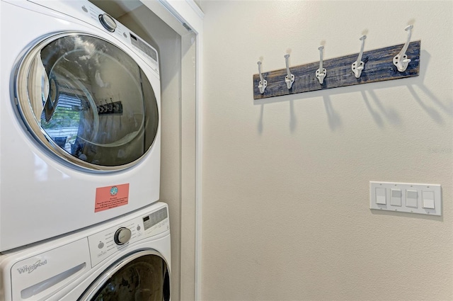 washroom with stacked washer and dryer