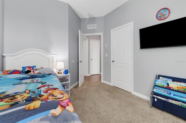 bedroom featuring light colored carpet