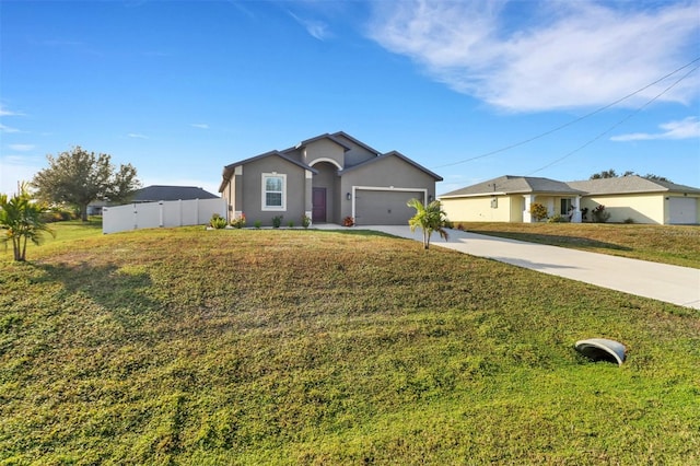 ranch-style home featuring a garage and a front yard