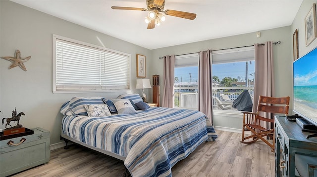 bedroom with light hardwood / wood-style flooring and ceiling fan