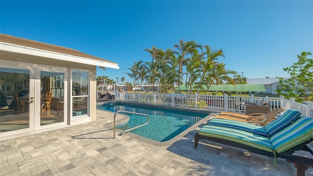 view of swimming pool with a patio area