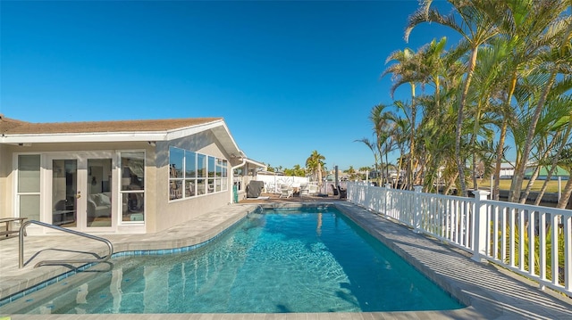 view of swimming pool with a patio