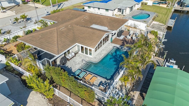 birds eye view of property with a water view