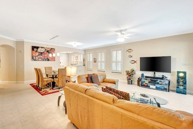 living room with tile patterned floors, ceiling fan, and crown molding