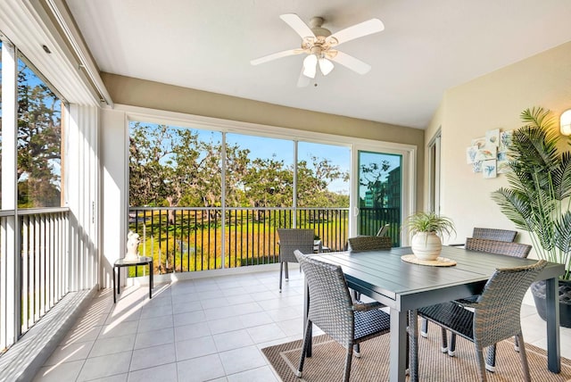 sunroom / solarium featuring ceiling fan