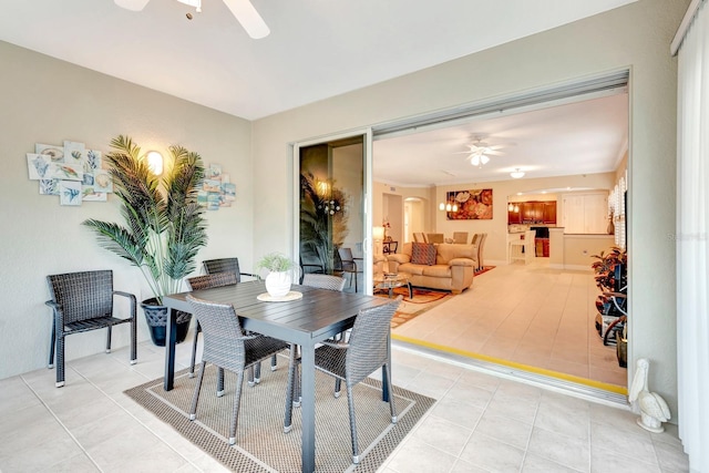 dining area with ceiling fan and light tile patterned floors