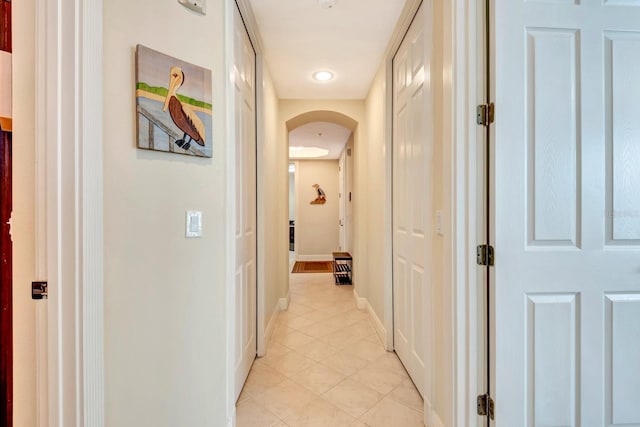 hallway featuring light tile patterned floors