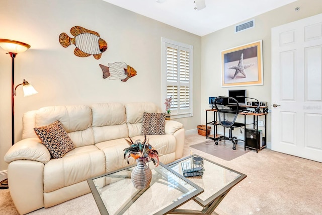 carpeted living room featuring ceiling fan