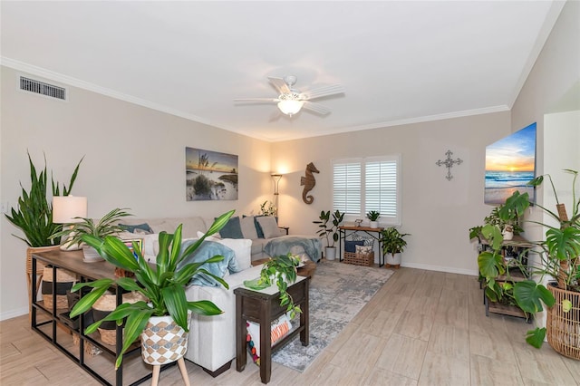 living room with ceiling fan, light wood-type flooring, and crown molding