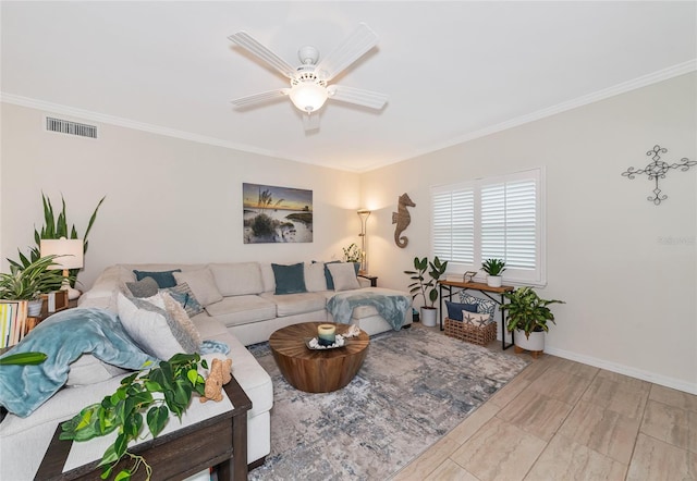 living room featuring ceiling fan and ornamental molding