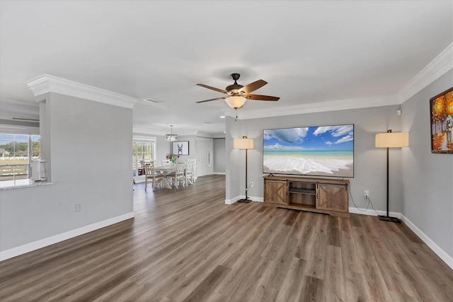 unfurnished living room featuring crown molding, ceiling fan, and hardwood / wood-style flooring