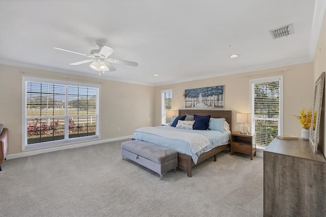 bedroom featuring ceiling fan, ornamental molding, and light carpet