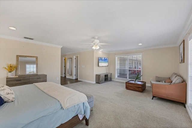 bedroom with carpet flooring, ceiling fan, ornamental molding, and multiple windows