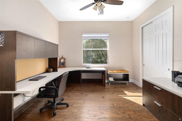 office area featuring ceiling fan, hardwood / wood-style floors, and built in desk