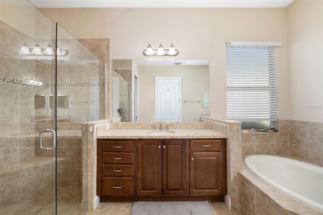 bathroom featuring tile patterned floors, vanity, and independent shower and bath